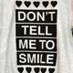 Illustration for article titled We Need This Dont Tell Me to Smile Sweatshirt